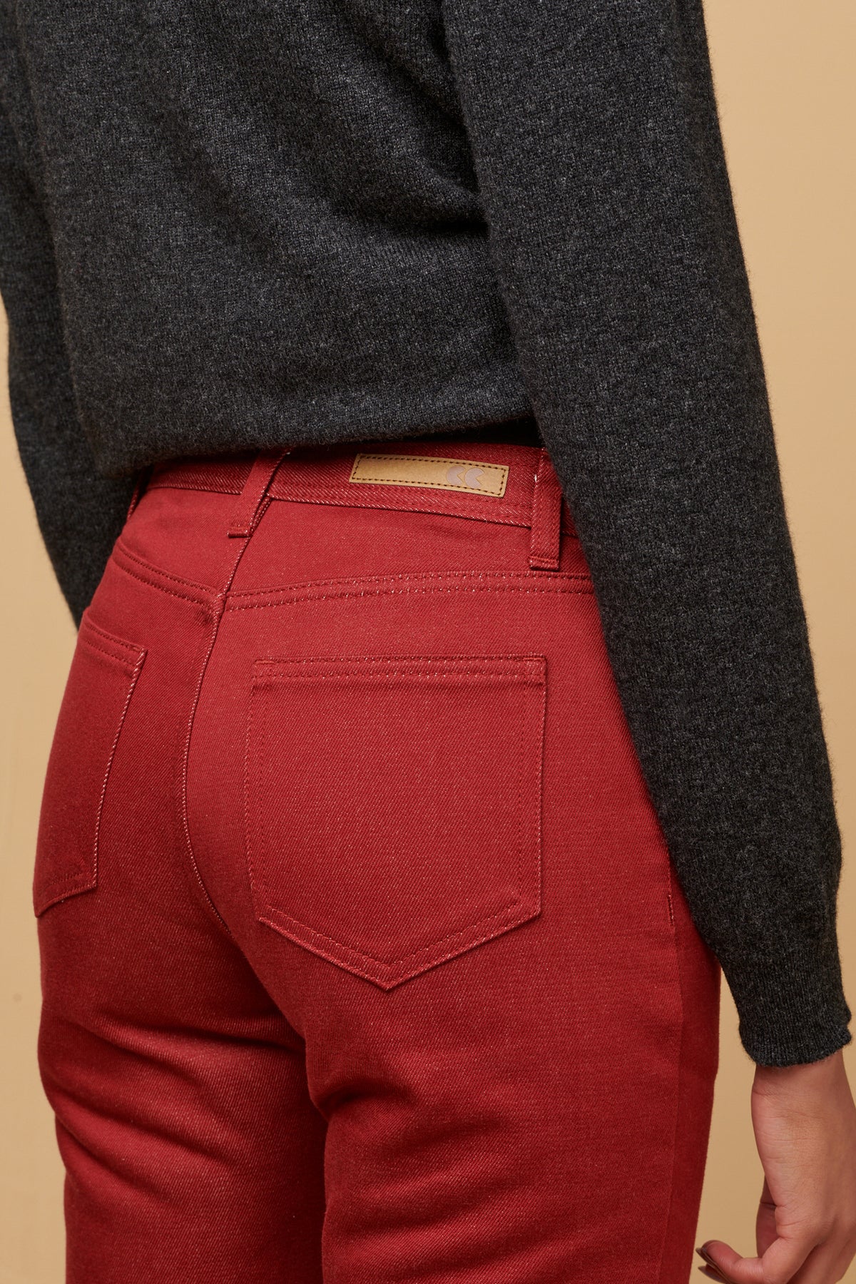 
            The back of women&#39;s Gloria Jean with two back pockets CC logo jeans patch on the waistband with belt loops.