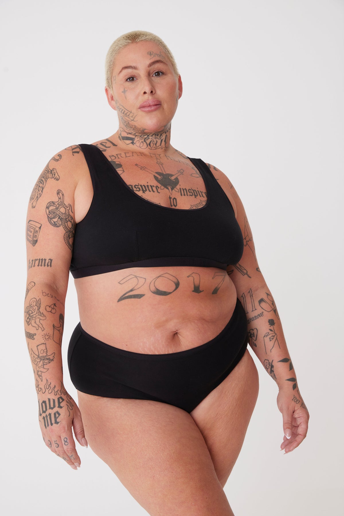 
            tattooed, plus size, white female in black high rise brief