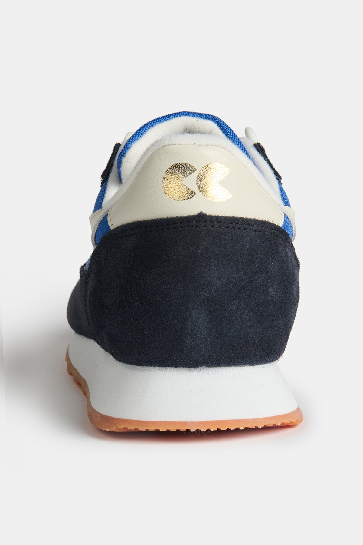 
            The navy and white heel of women&#39;s Parlick style Trainer in blue/ navy/ off white with gold CC foil logo