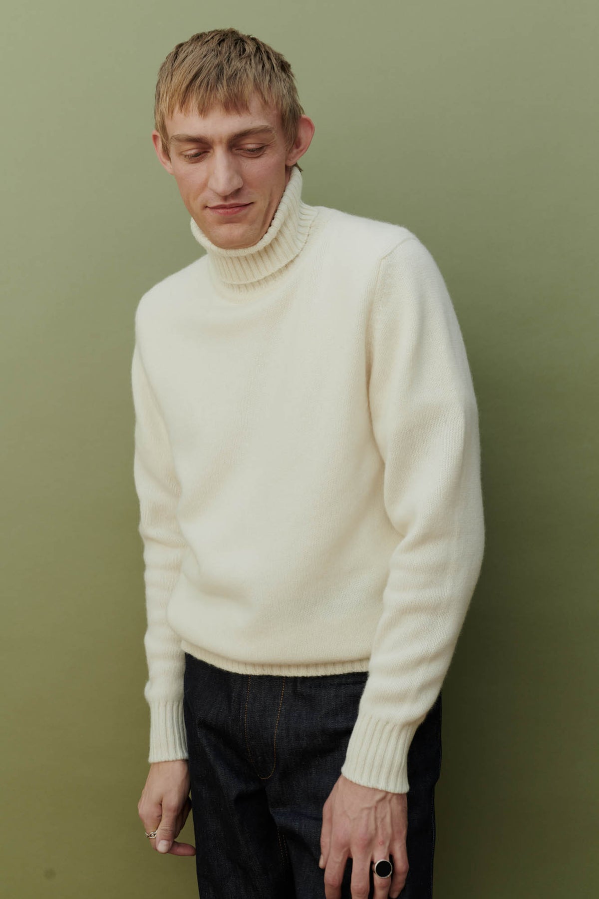 
            Male wearing Lambswool roll neck in Ecru